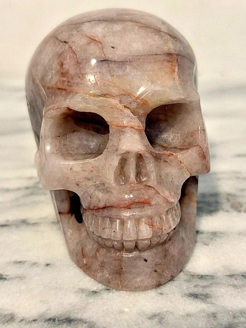 Carved Skull Sculpture Pink quartz Brown